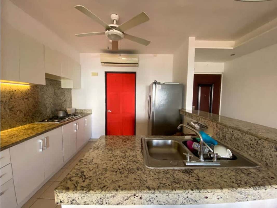 Urban street view with PH Saramel mid-rise tower Parque Lefevre Panama City