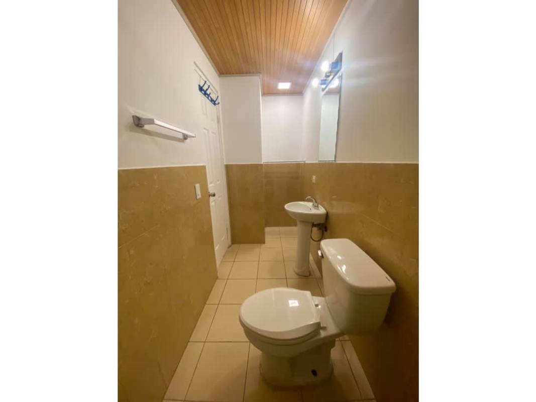 Kitchen with granite counters, gas stove, refrigerator, ceiling fan PH Saramel Parque Lefevre