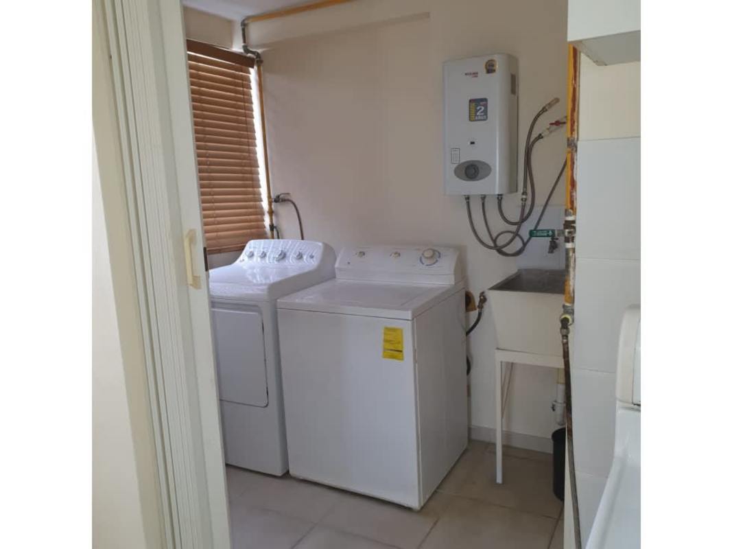 Laundry utility area with washer water heater window PH Victory Towers Panama