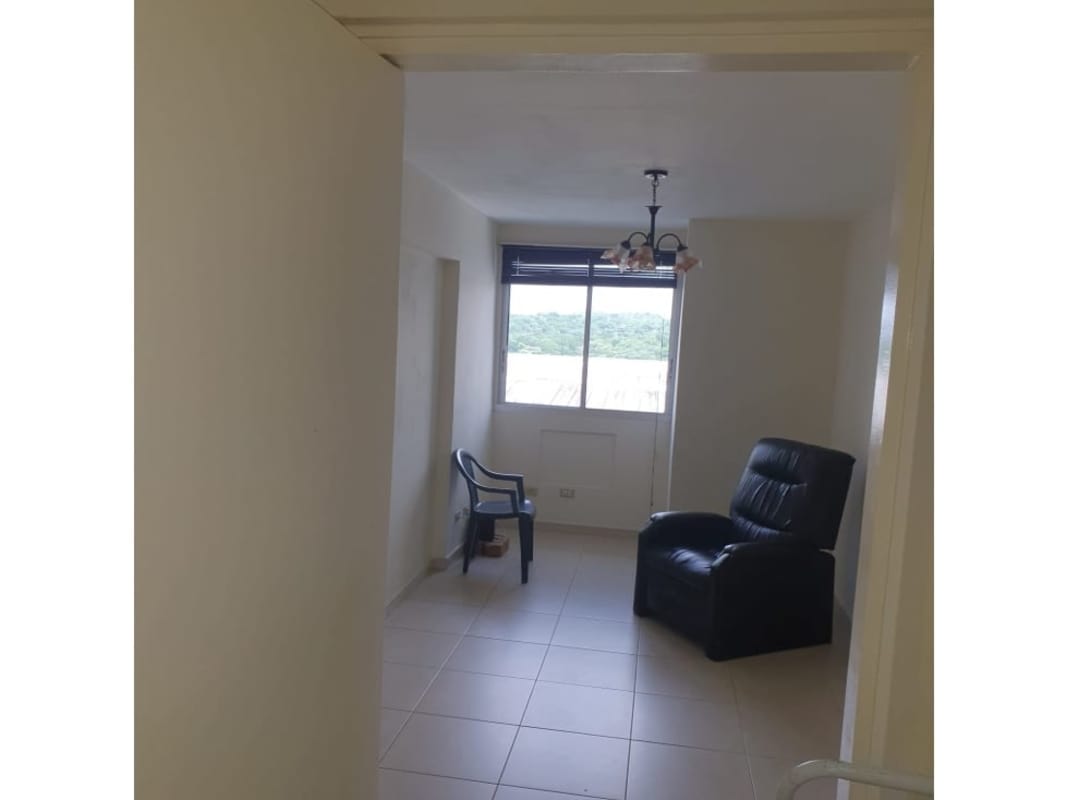 Minimalist living room with tile floor and window PH Victory Towers Panama