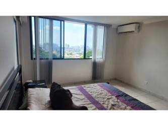 Bathroom with tiled walls, pedestal sink and shower in PH Fountain View El Dorado Panama