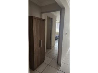 Dining area with black chairs, modern decor, and large windows in PH Fountain View El Dorado Panama