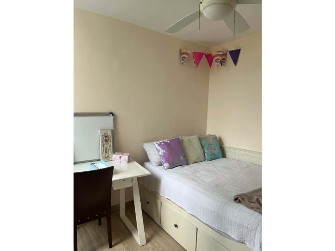 Bedroom space with wood floors and large windows in Tower Park Parque Lefevre Panama
