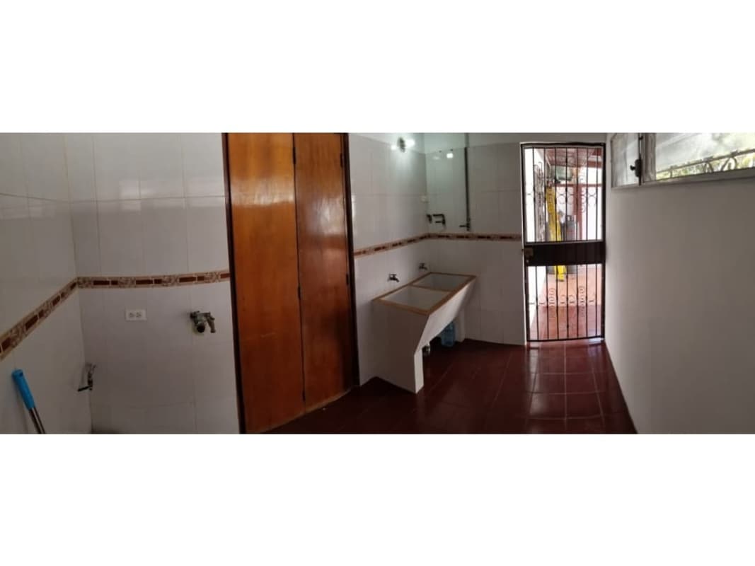 Kitchen with granite countertops wood cabinetry refrigerator tile floor Reparto Nuevo Panamá