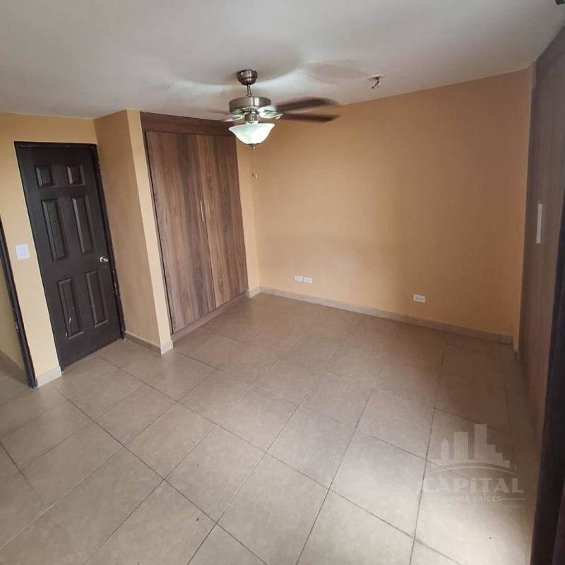 Bedroom with built-in wooden closet ceiling fan beige tiles PH Villa Andalucía Las Acacias Panama
