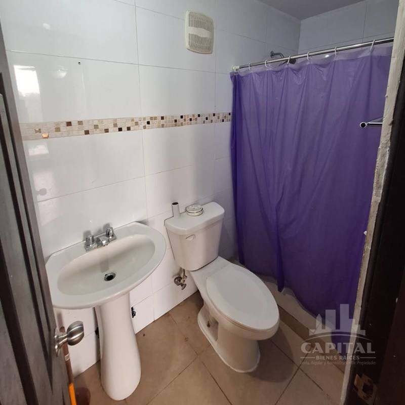 Modern bathroom with white tiles pedestal sink walk-in shower PH Villa Andalucía Las Acacias Panama