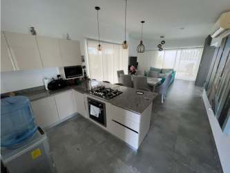 Two car covered parking and entry at Villa Mamey Punta Barco beach home