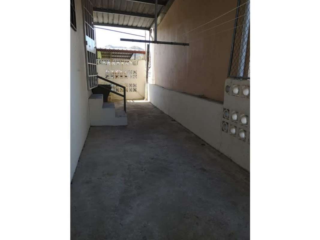 Fenced backyard patio and covered corridor of mixed-use home near Tumba Muerto Panama City