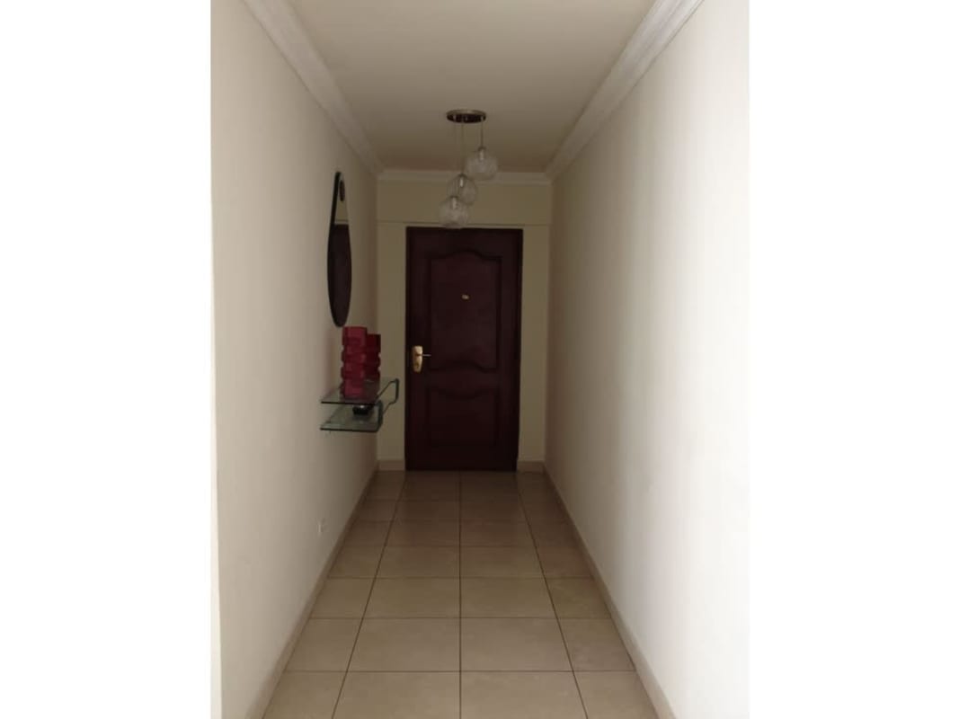 Entrance hallway with glass console, mirror, modern decor PH Onyx Towers El Cangrejo Panama City