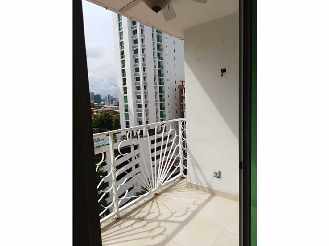 Covered balcony with white railing, ceiling fan overlooking Panama skyline PH Onyx Towers