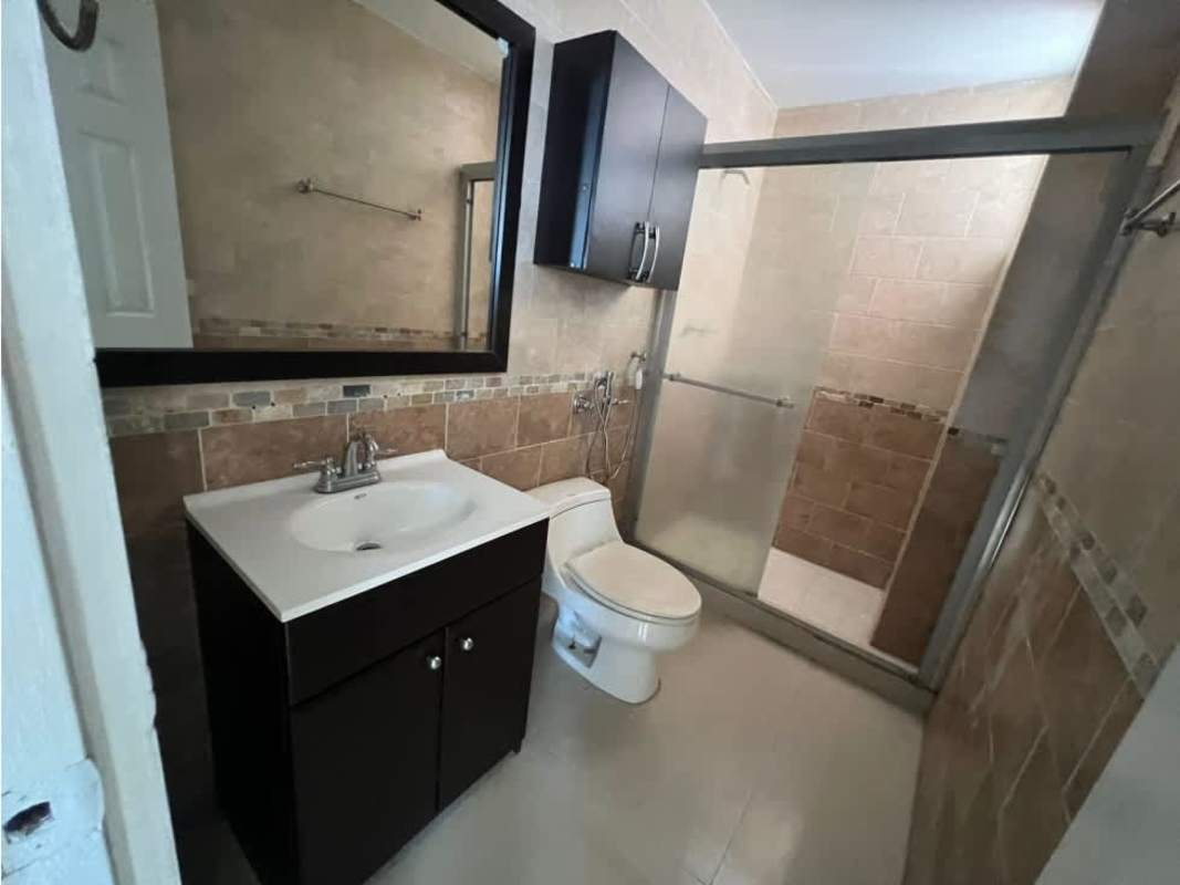 Bedroom with closet space and city view in Dos Mares apartment Panama