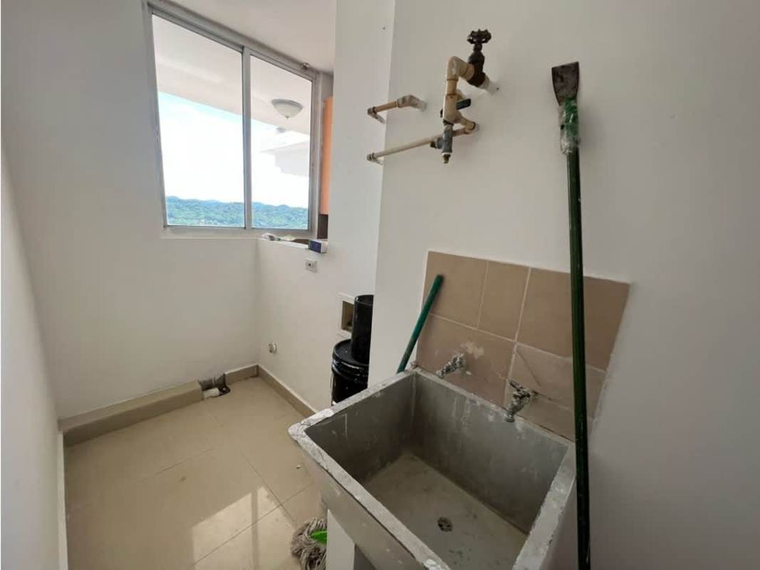 Laundry utility area with mountain view window in Dos Mares View apartment Panama