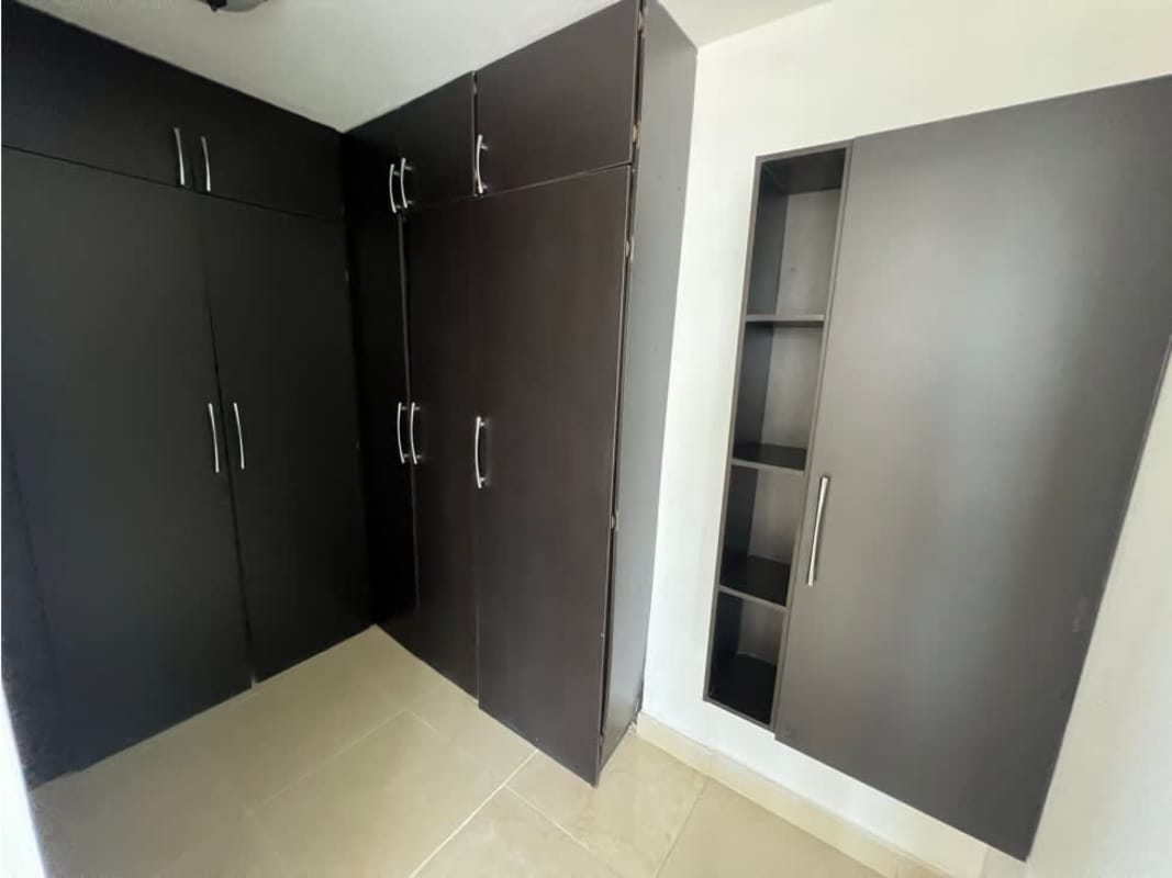 Contemporary closet space in Dos Mares View apartment Villa de las Fuentes Panama