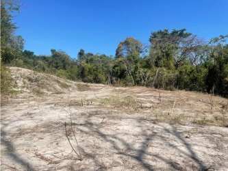 Natural cleared sandy lot surrounded by tropical forest PH Costa Esmeralda San Carlos Panama