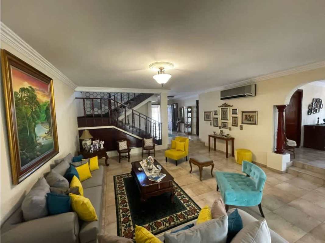 Spacious traditional living room with sofas, large windows, tile floors in luxury home Panama