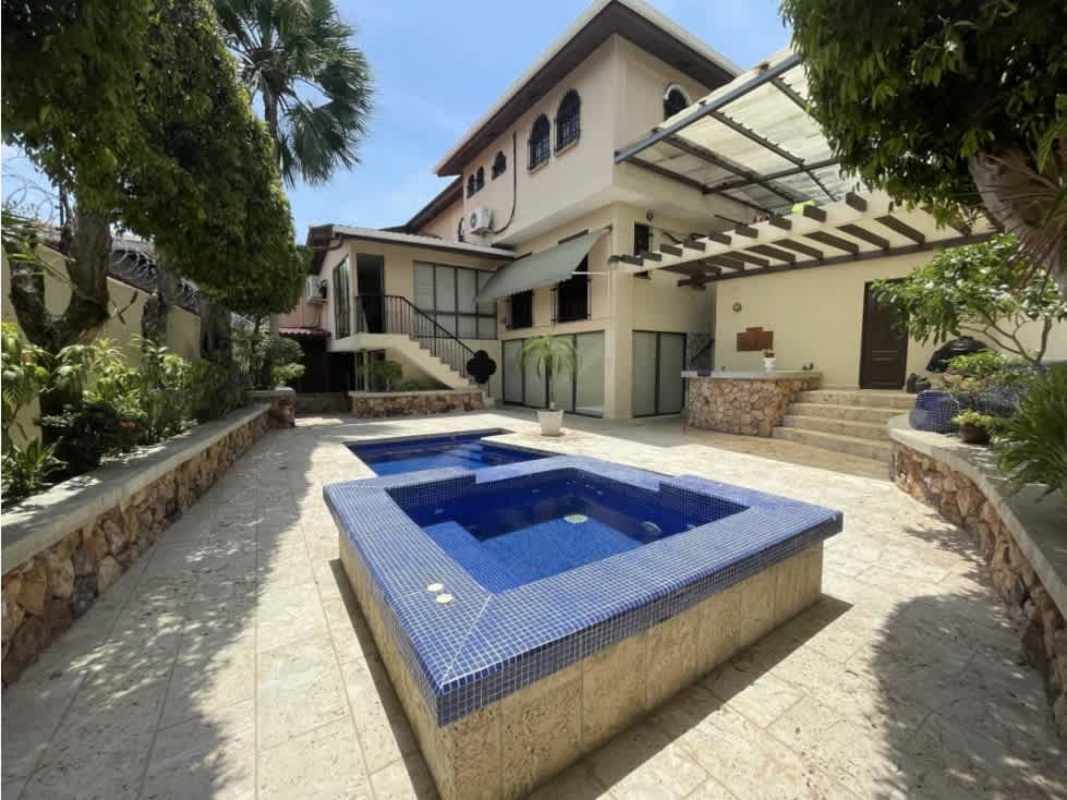 Large bedroom with built-in closet, AC, and wood floors in furnished house Betania Panama