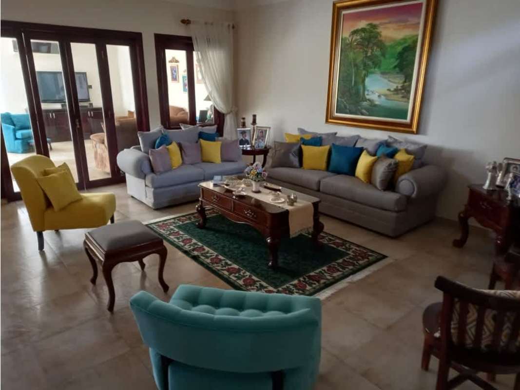 Elegant formal dining room with large windows and access to terrace in La Alameda Panama City