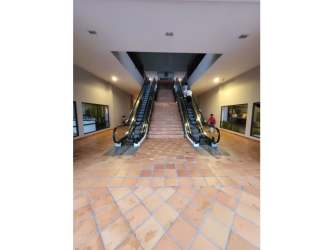 Escalators inside The Village Shopping Center Coronado Panama upper floor access