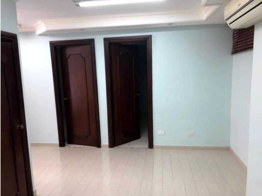 Interior hallway with multiple wooden doors and AC unit ground floor commercial unit Santa Elena Panama