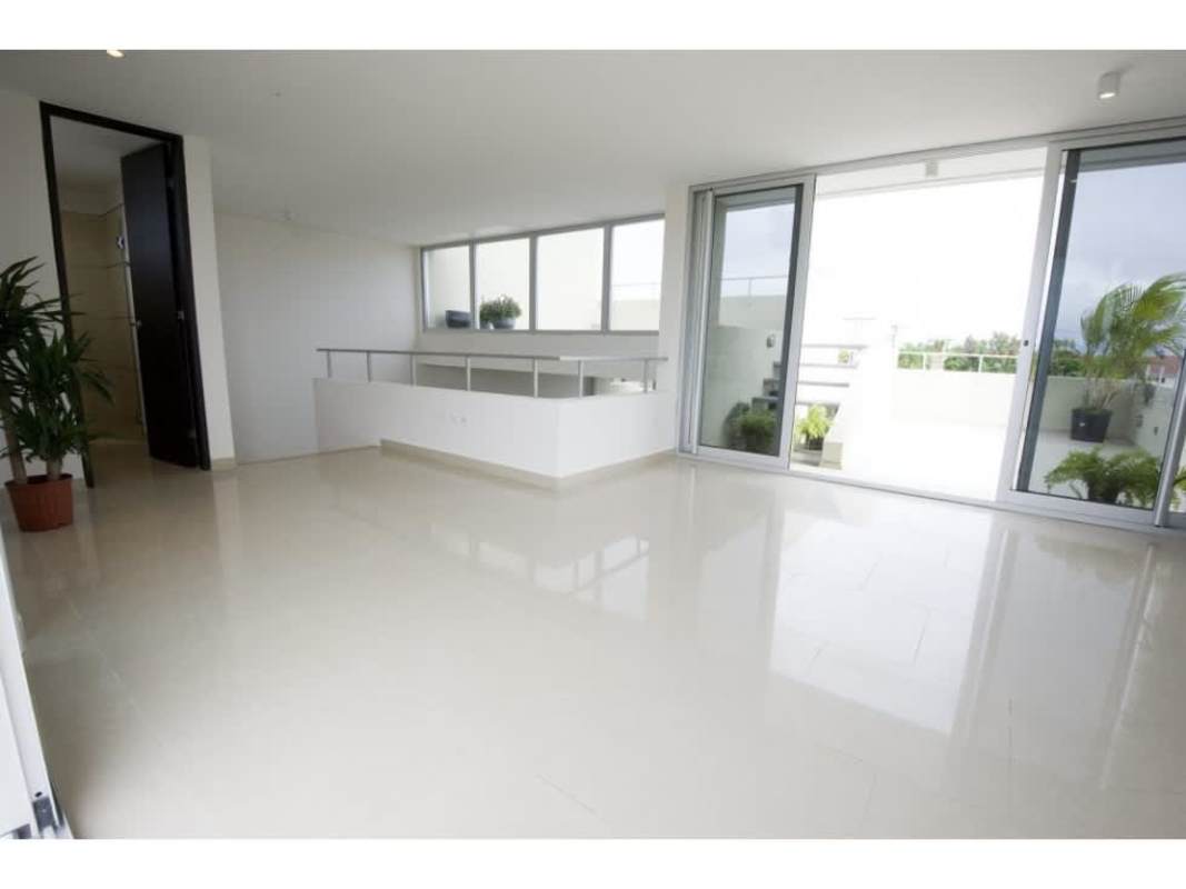 Modern rooftop terrace with tile flooring, planters and stairs Costa Sur Village townhouse