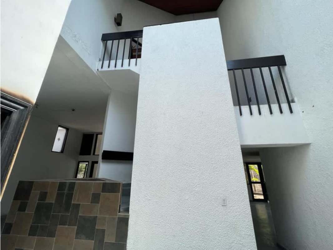 Large bright living area with tile floors and oversized windows in Coco del Mar Panama