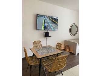 Compact kitchenette granite counter appliances modern studio Playa Blanca Panama