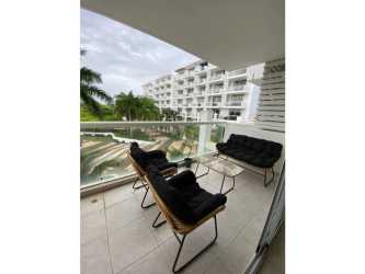 Balcony with outdoor seating, glass railing and views of gardens and pool PH Town Center Playa Blanca Panama
