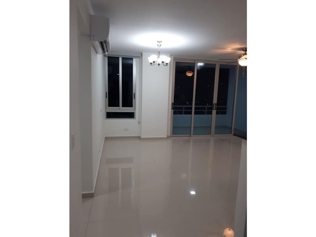 Bright open living room with tile floors, air conditioning, ceiling fan and access to balcony PH Macedonia Tower Panama City