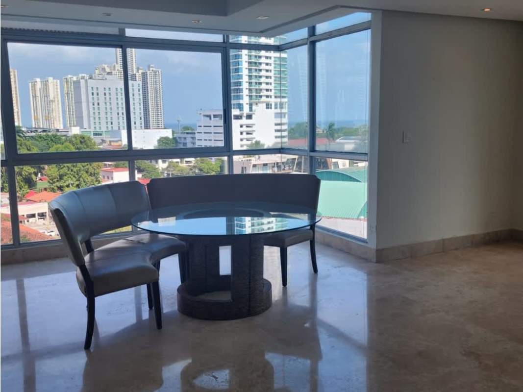 Modern bedroom with corner windows and panoramic city and ocean view at PH Terrazas del Pacífico Panama City