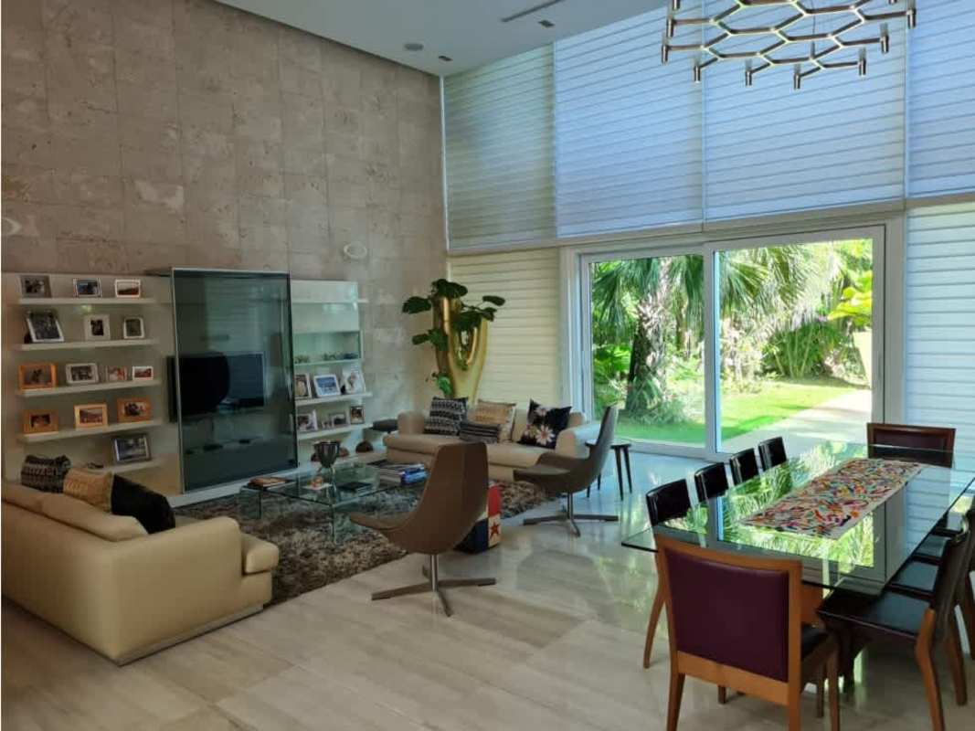 Spacious living room with marble floors, double height ceiling in PH Costa Esmeralda Costa Sur