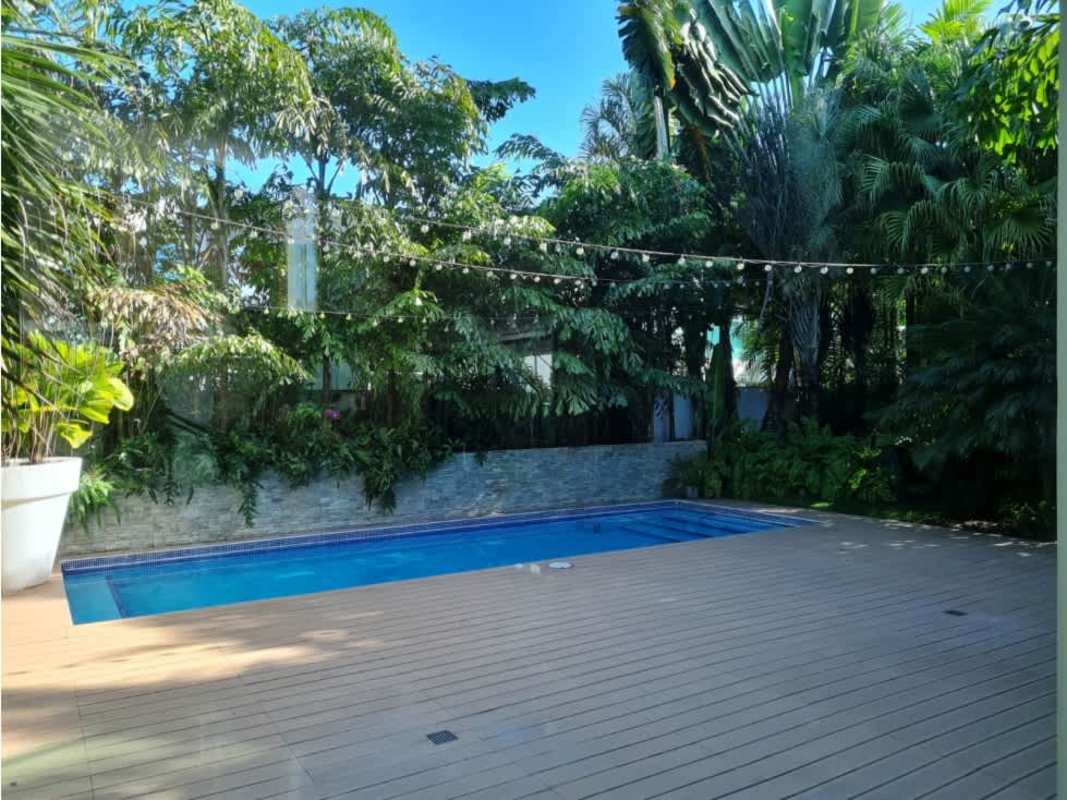 Bathroom with marble finishes and glass shower enclosure PH Costa Esmeralda Panama