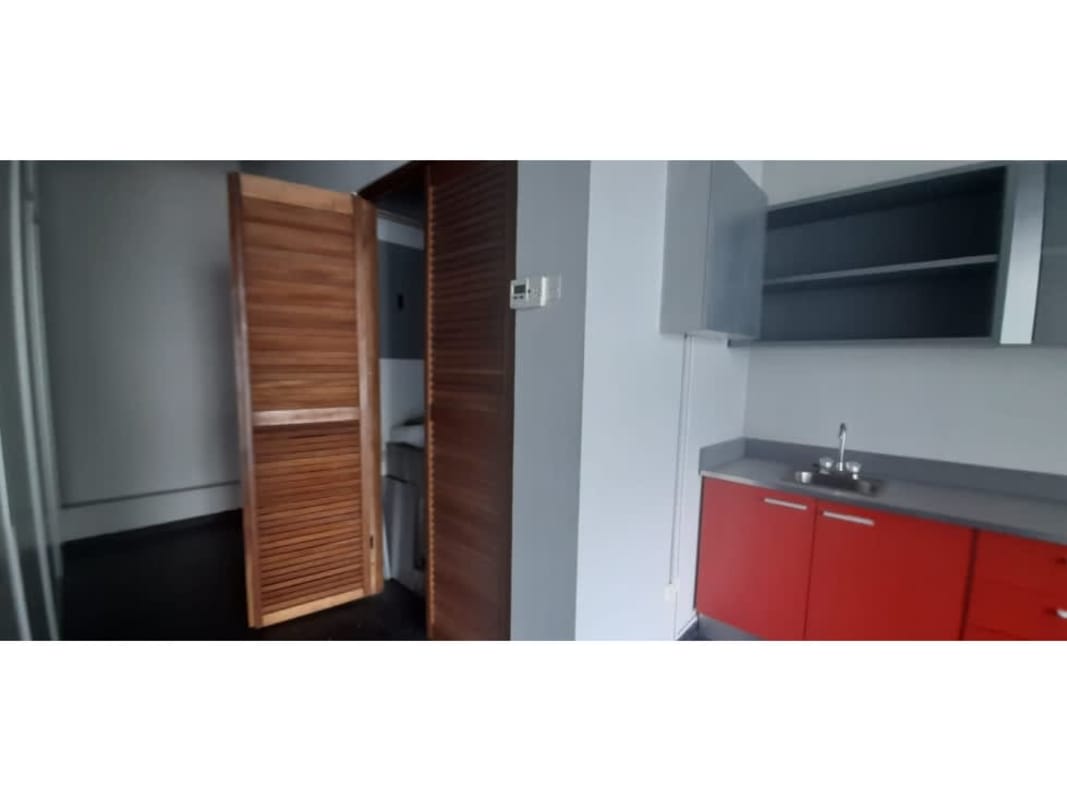 Compact kitchenette with cabinetry inside office PH Global Bank Tower Panama
