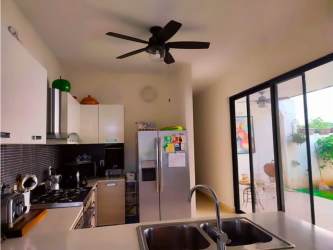 Modern bathroom double vanity with wood cabinetry and large mirror River Valley Panama Pacifico