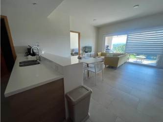 Open kitchen and living area with natural light at Playa Escondida resort Panama