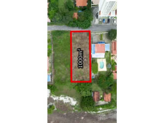 Aerial perspective of rectangular undeveloped land outlined in red close to Pacific beach Malibú Nueva Gorgona Panama