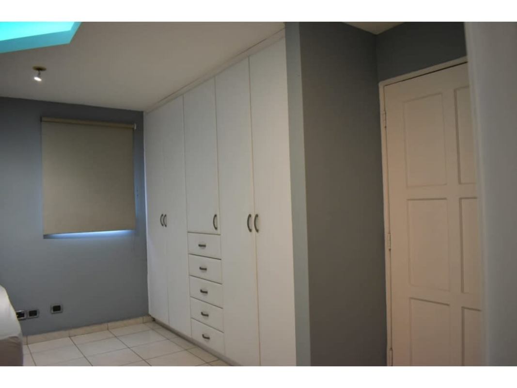 Kitchen area blue cabinets tiled floor Residencial Don Arturo house for sale El Cangrejo Panama