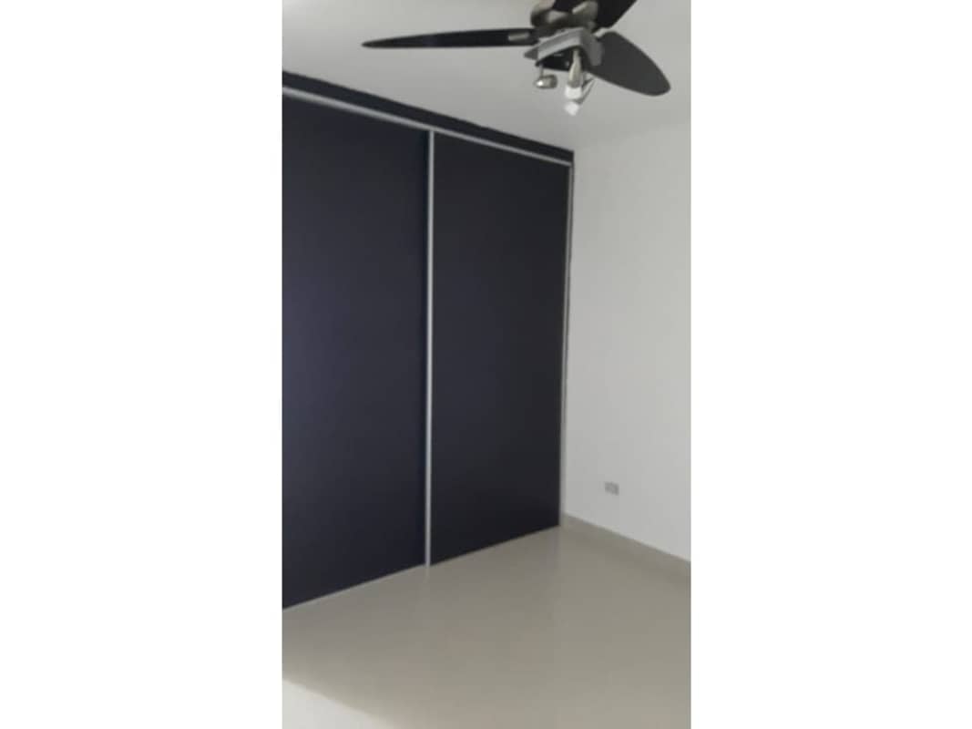 Second bedroom interior with built-in closet and tile floors PH Altamira Gardens Ancón Panama