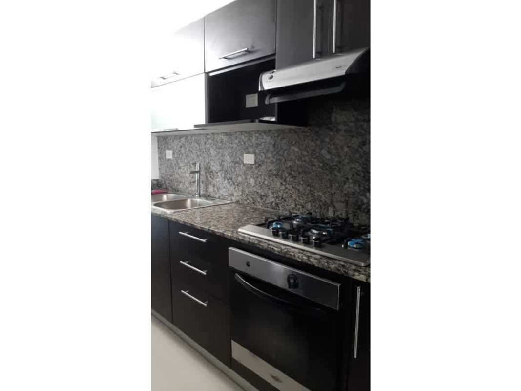 Kitchen with dark cabinets granite counters stainless appliances PH Altamira Gardens Panama