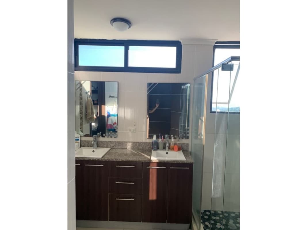 Bathroom with granite countertop, double sink, glass shower PH Portofino Tower Panama