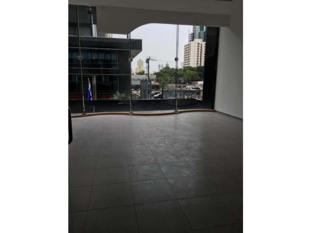 Large modern lobby glass entrance of Sortis Business Tower Panama banking area