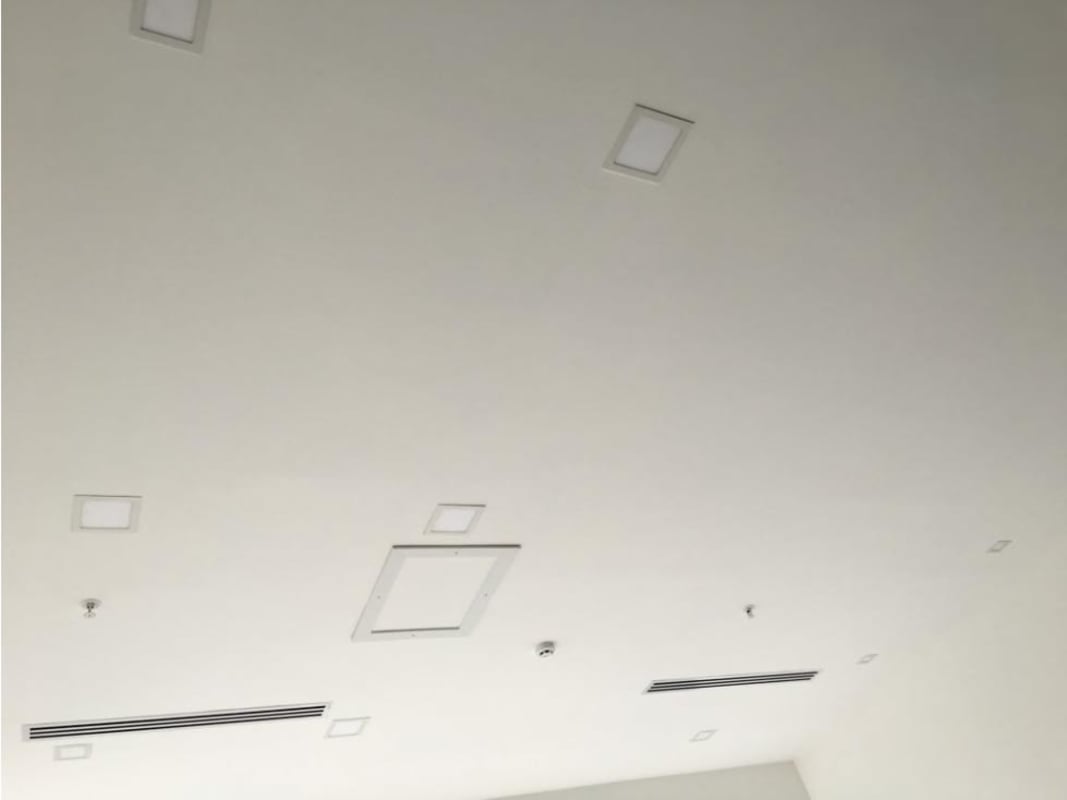 Modern bathroom with pedestal sink inside mezzanine office PH Sortis Business Tower Obarrio