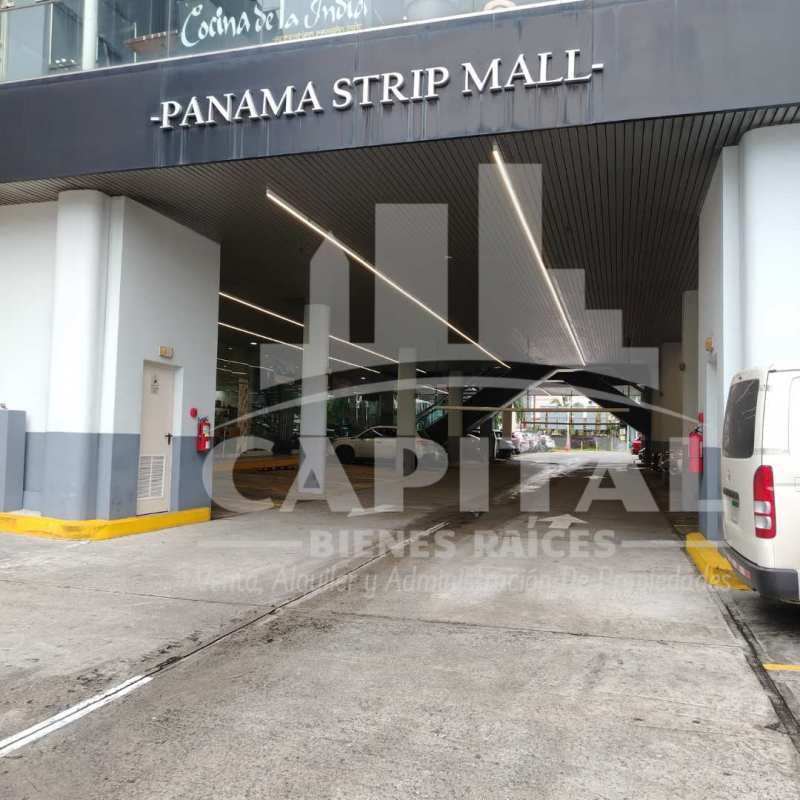 Modern exterior of commercial retail space with glass railing and bar seating Avenida Balboa