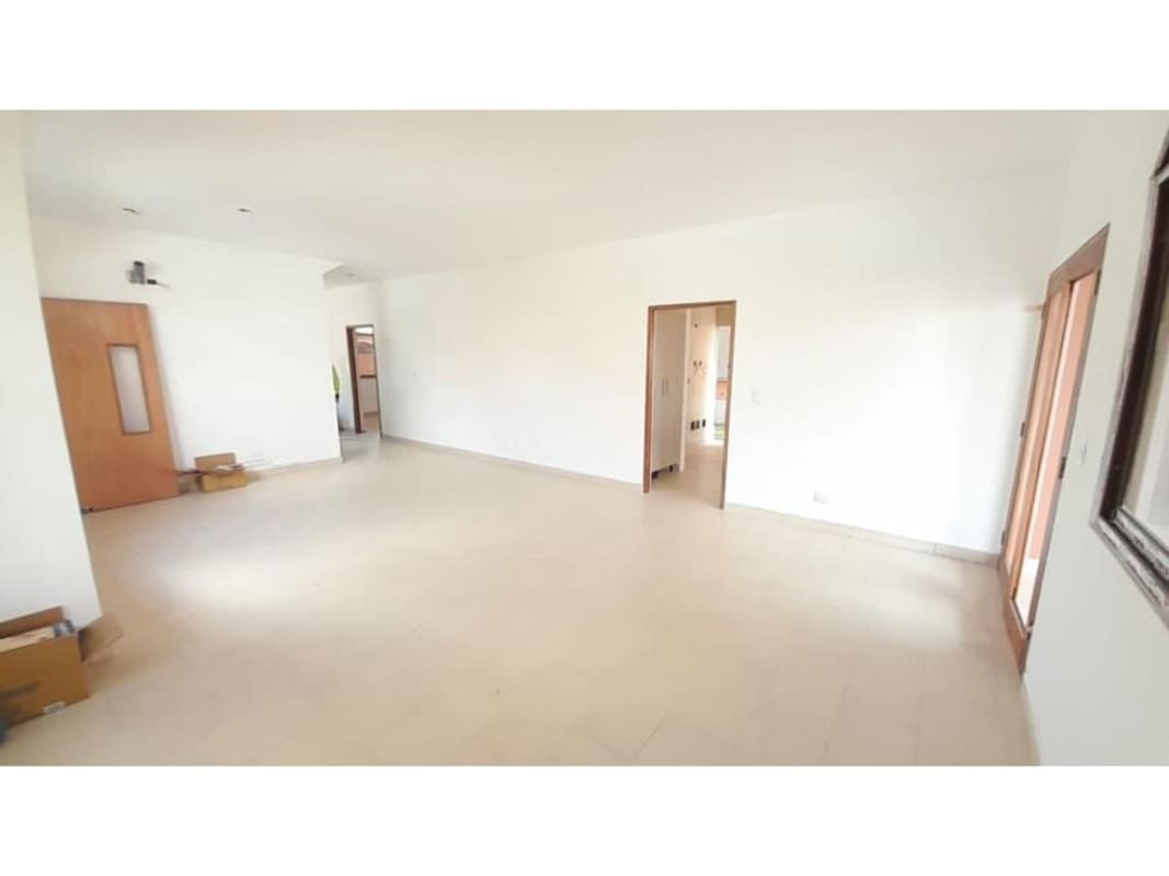 Minimalist living area with tile floors and natural light in El Doral Costa Sur Panama
