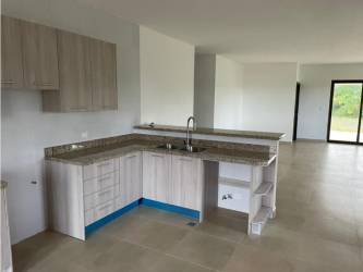 Spacious open-plan living dining room tiled floors garden views Hacienda Pacifica San Carlos