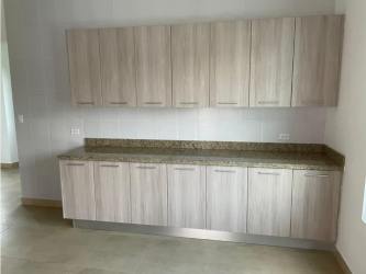 Spacious bathroom with granite double vanity and vessel sinks in new country house Panama