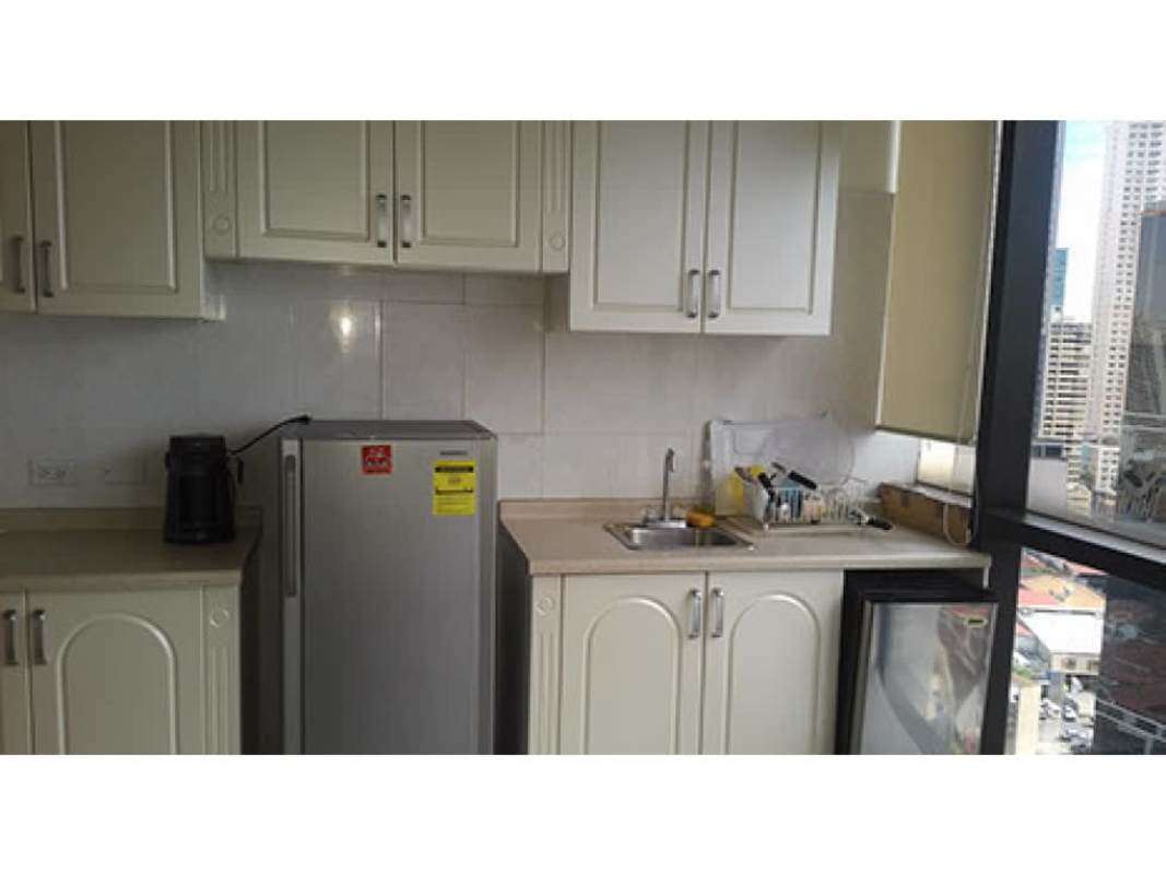 Small pantry kitchenette with window city view white cabinets Obarrio Panama City