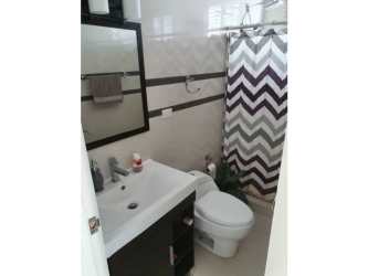 Covered terrace overlooking garden area in The Village Beach Residences San Carlos Panama