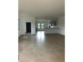 Covered terrace patio overlooking large yard in Hacienda Pacifica country house Panama