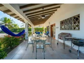Spacious covered patio terrace overlooking ocean at Playa Blanca beachfront villa in Panama