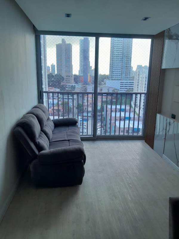 Bedroom with large windows, ocean and city skyline views in PH Destiny Tower Panama City